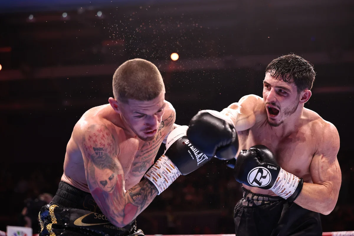 Louie O’Doherty, on the right, throwing a punch during a boxing contest