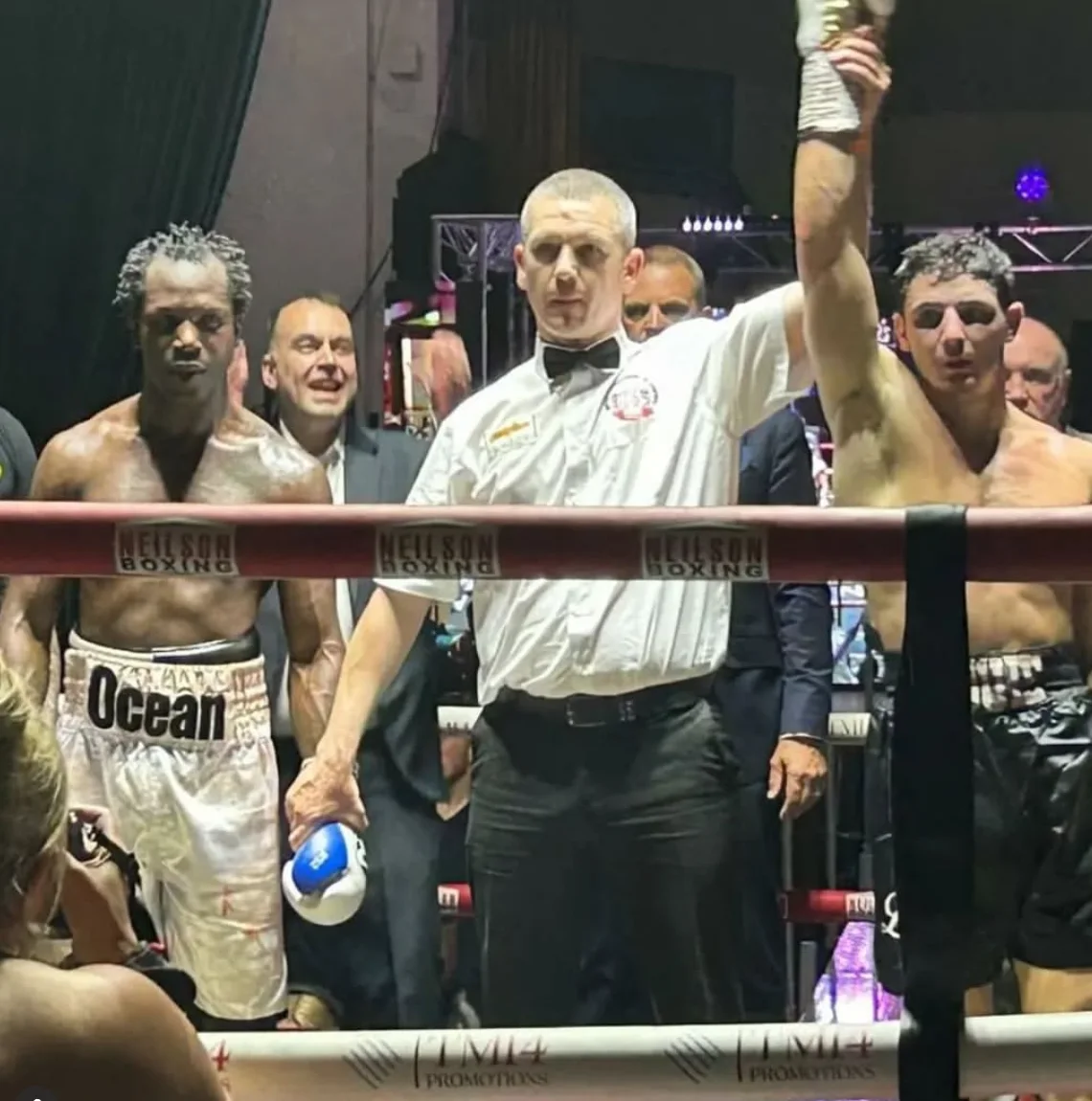 Louie O’Doherty has his hand raised beside Jeff Ofori after their fight