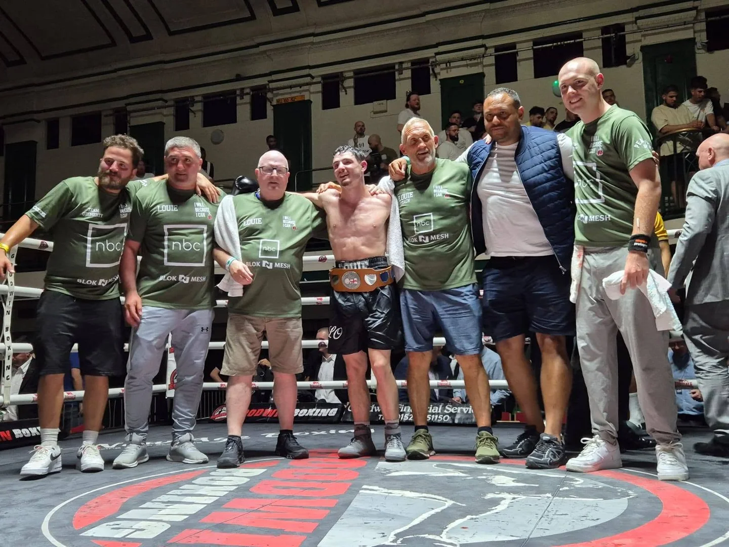 Louie and his team celebrating in the ring